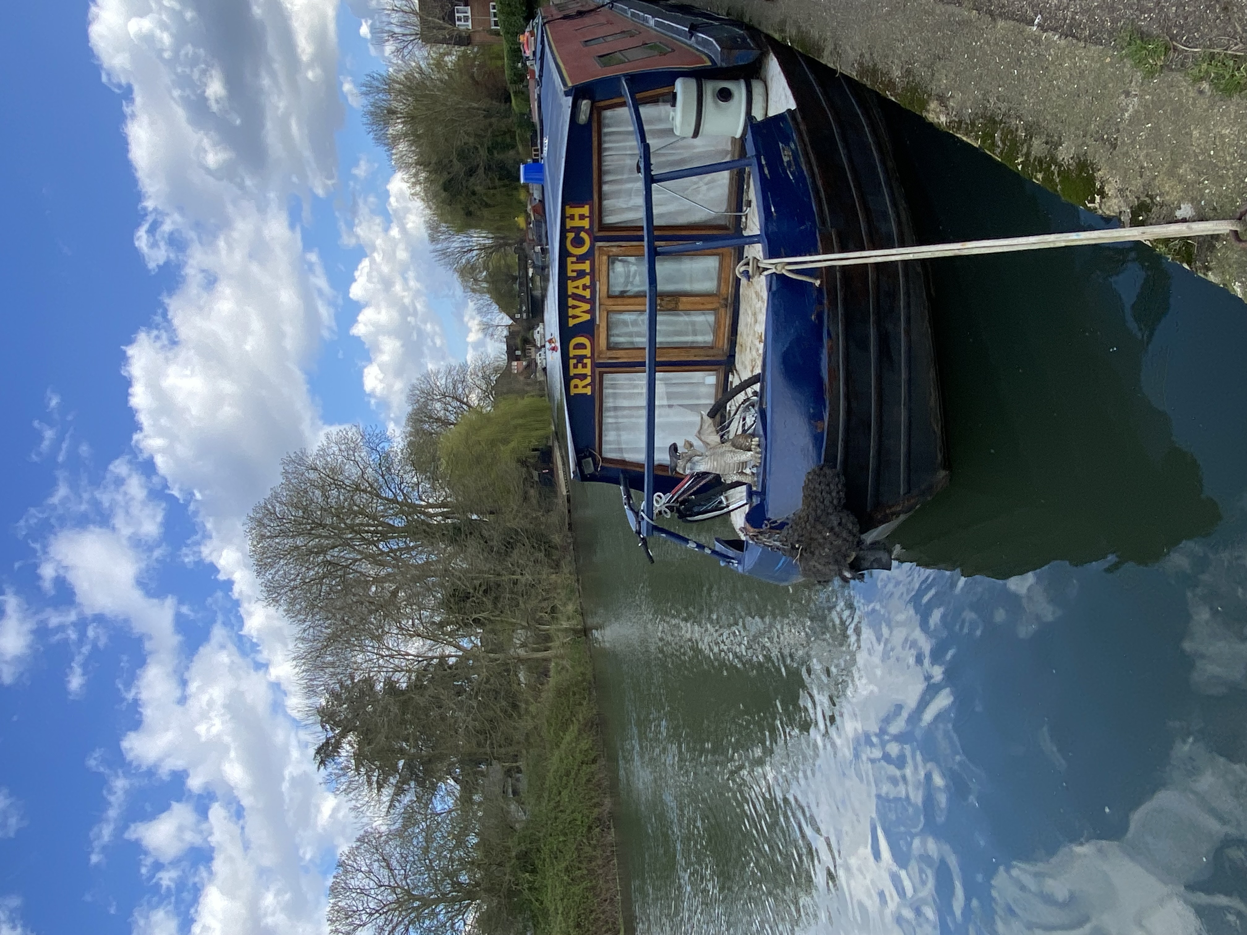 blue barge on river